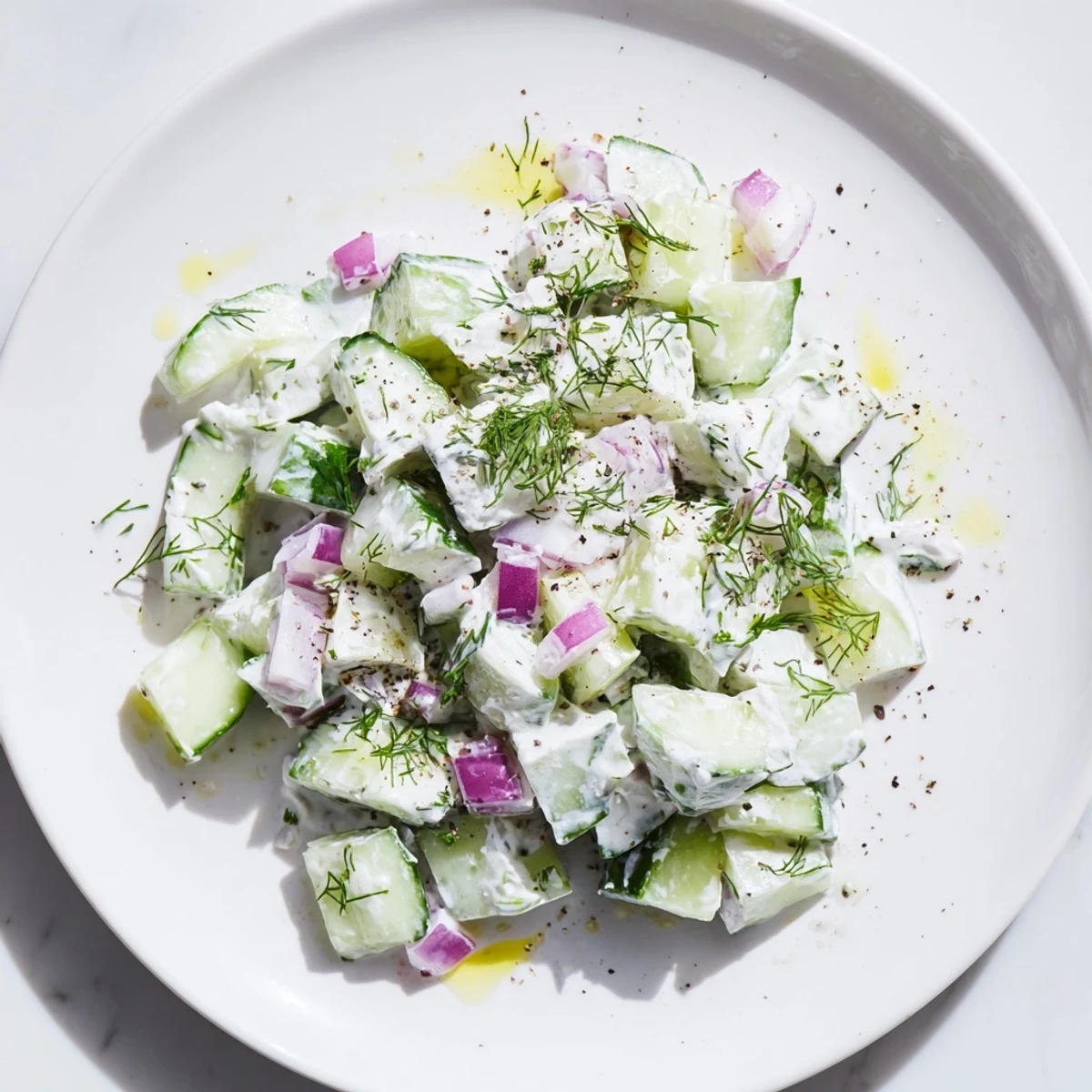 Vibrant photo of chilled Cucumber and Greek Yogurt Tzatziki Salad garnished with fresh herbs.