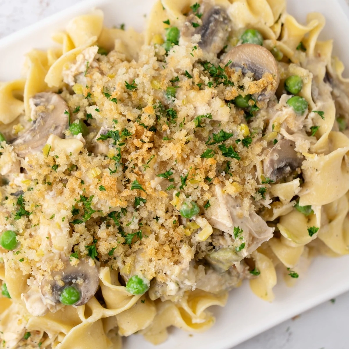 Golden, bubbly Tuna Noodle Casserole just pulled from the oven, ready for serving.