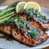 Perfectly flaky Marry Me Salmon with roasted asparagus and cherry tomatoes for a healthy dinner.