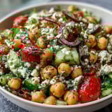 Cold Chickpea Salad with Lemon Herbs: a vibrant, colorful bowl of fresh vegetables, herbs, and creamy chickpeas in a zesty lemon dressing.