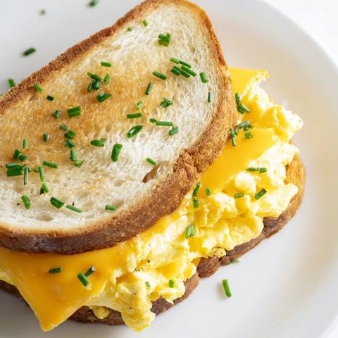 Golden, cheesy One-Pan Egg Breakfast Sandwich, a beautiful quick breakfast with melted cheddar and fluffy eggs.