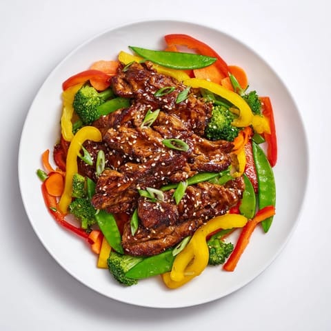 A close-up shot of Sheet Pan Chicken Stir-Fry, showcasing colorful bell peppers and tender chicken.