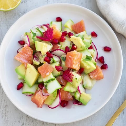 Vibrant Cucumber and Tinned Fish Salad, layered with fresh herbs and sardines, a light meal.