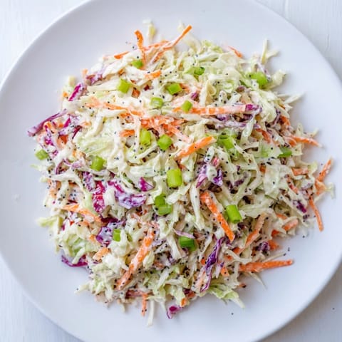 A colorful bowl of creamy Quick Coleslaw Salad, ready to enhance any barbecue meal.