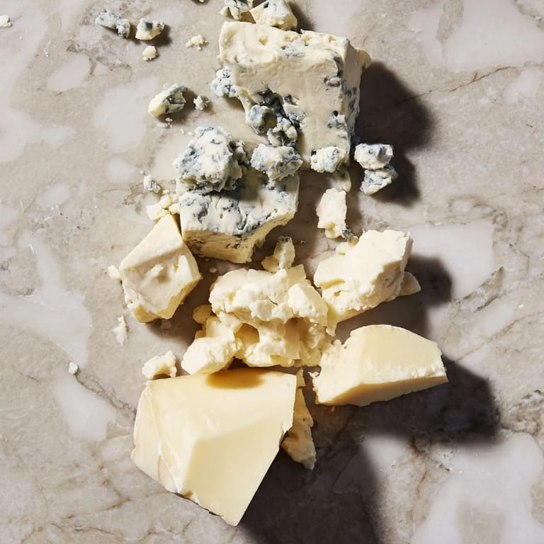 Get ready for a delicious Marble Quarry, beautifully arranged with contrasting cheese textures and colors.
