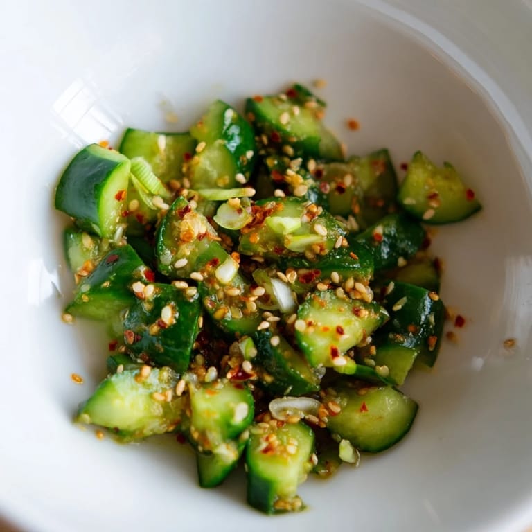 Close-up of a Cucumber Shaker bowl showcasing the crunchy, tangy Asian-inspired textures.