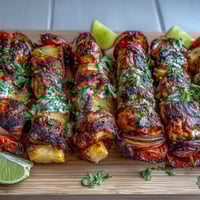 Grilled Pineapple Chicken Skewers with juicy chicken and sweet caramelized pineapple on skewers, perfect for summer barbecues and tropical flavor lovers.